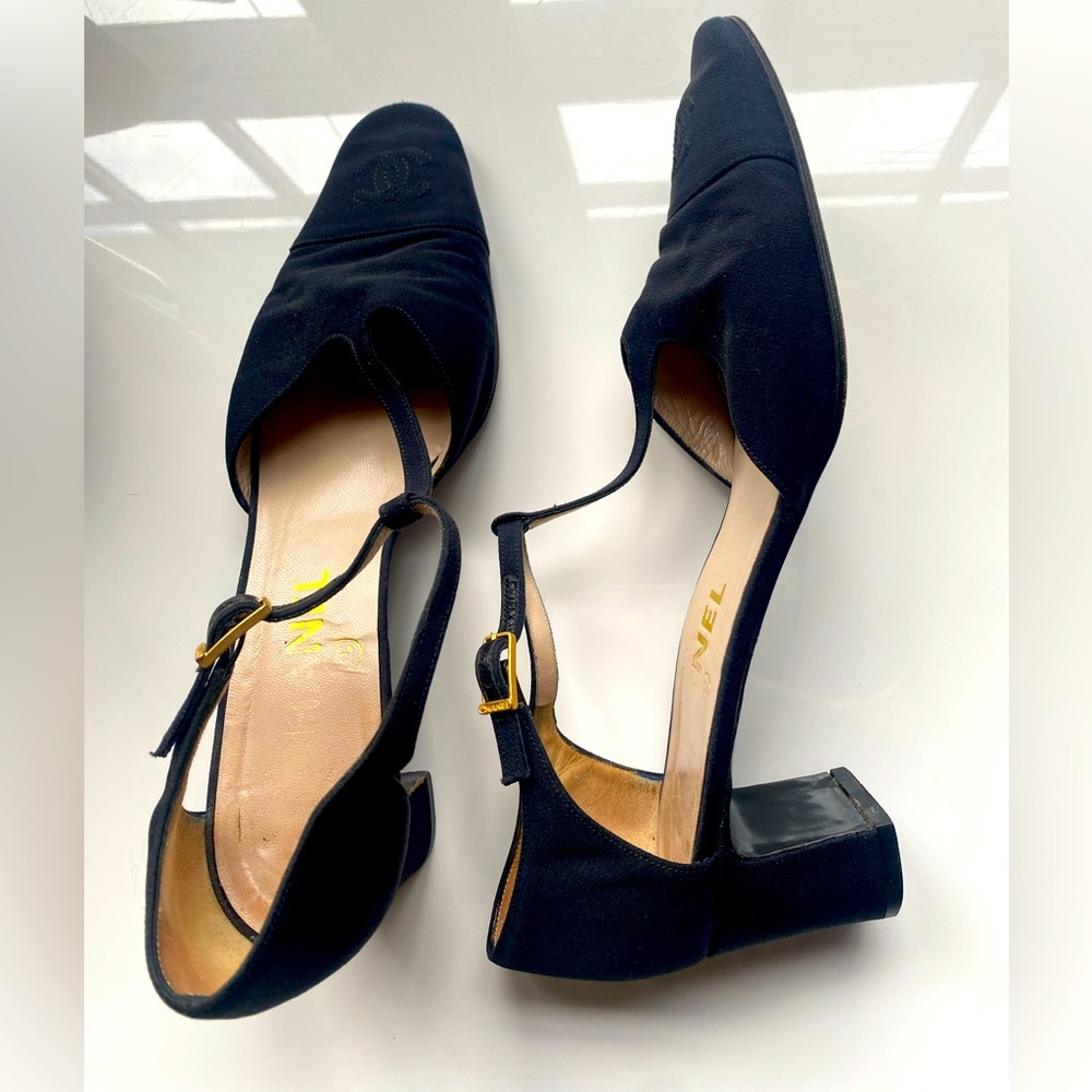 Chanel black satin ankle strap with stitched CC toe cap. Gold Chanel buckle.